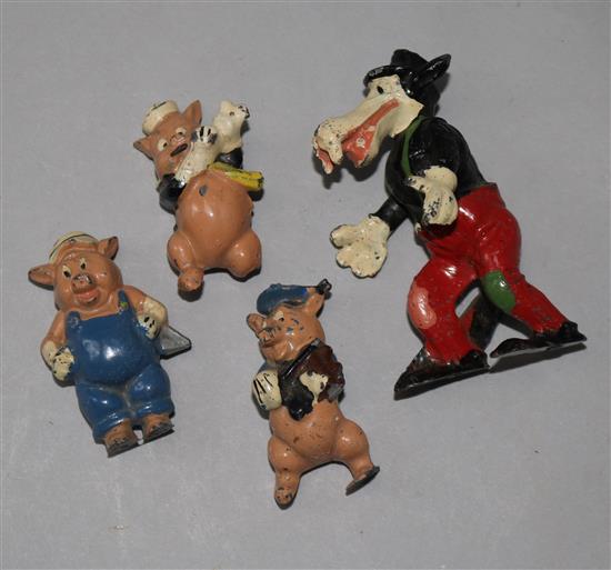 Four Disney pre-war hollow cast figures, Three Little Pigs and the Big Bad Wolf (damage and playworn)